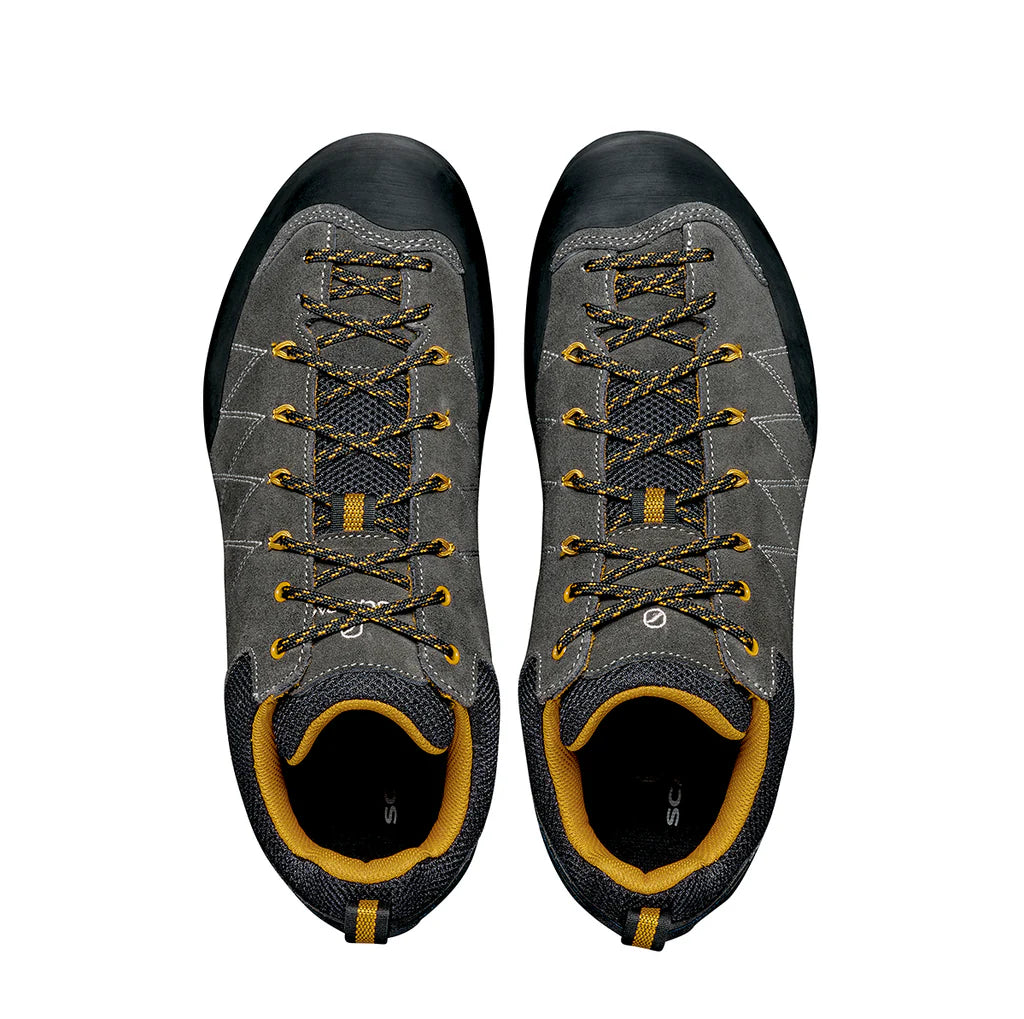Pair of gray and black hiking shoes with yellow accents on a white background