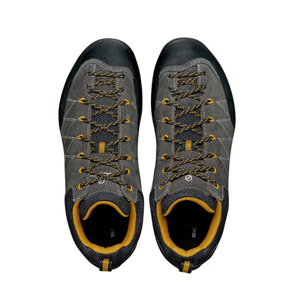 Pair of gray and black hiking shoes with yellow accents on a white background