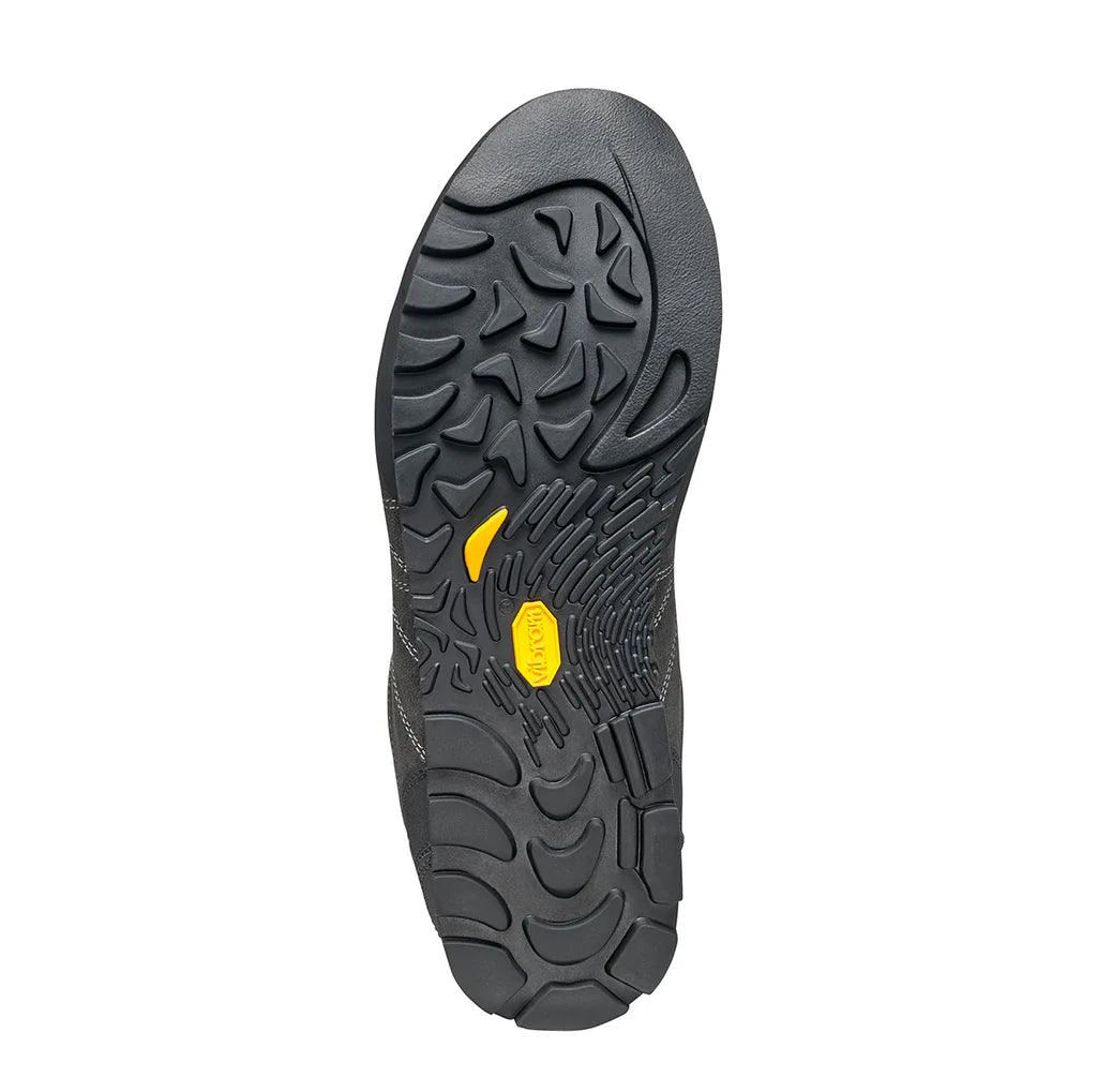 Close-up of a black shoe sole with a yellow logo on a white background