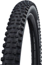 Close-up of a mountain bike tire with tread pattern on a white background