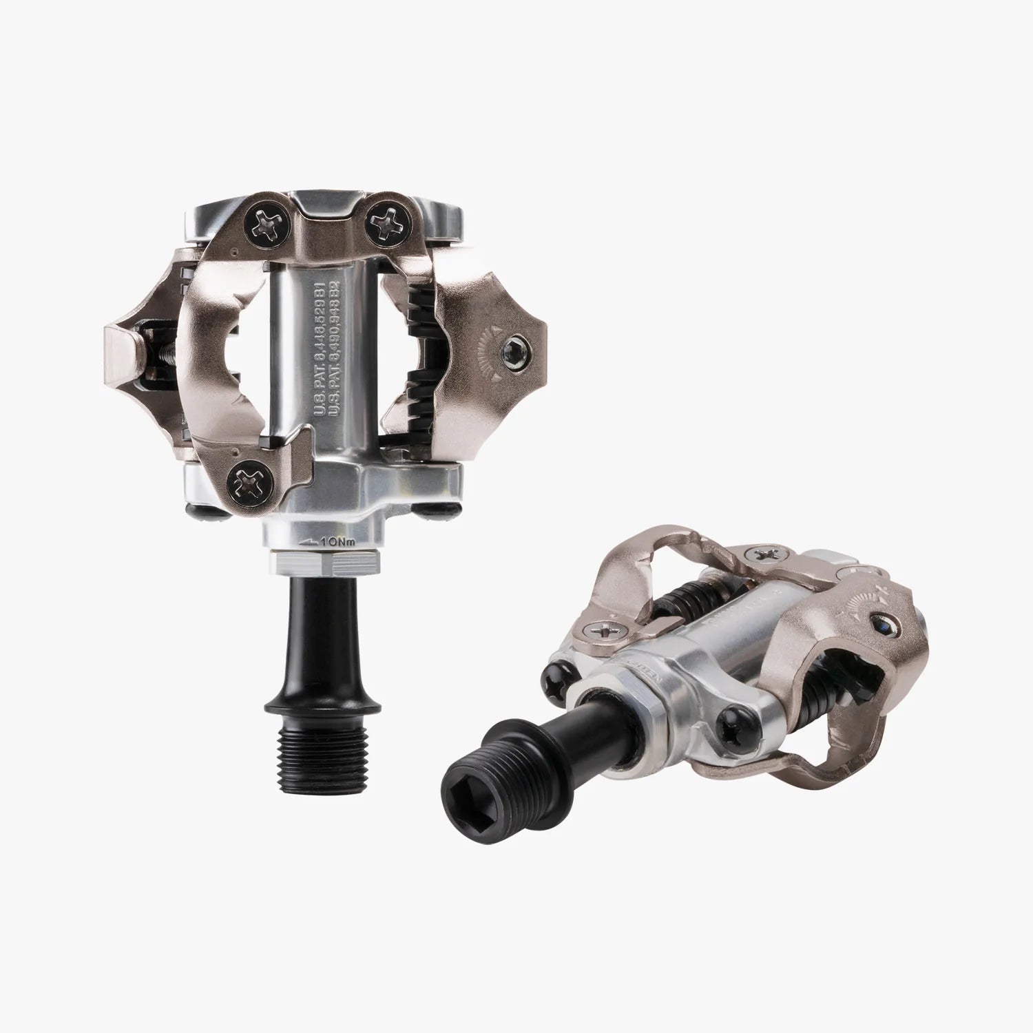 Pair of metallic bicycle pedals on a white background