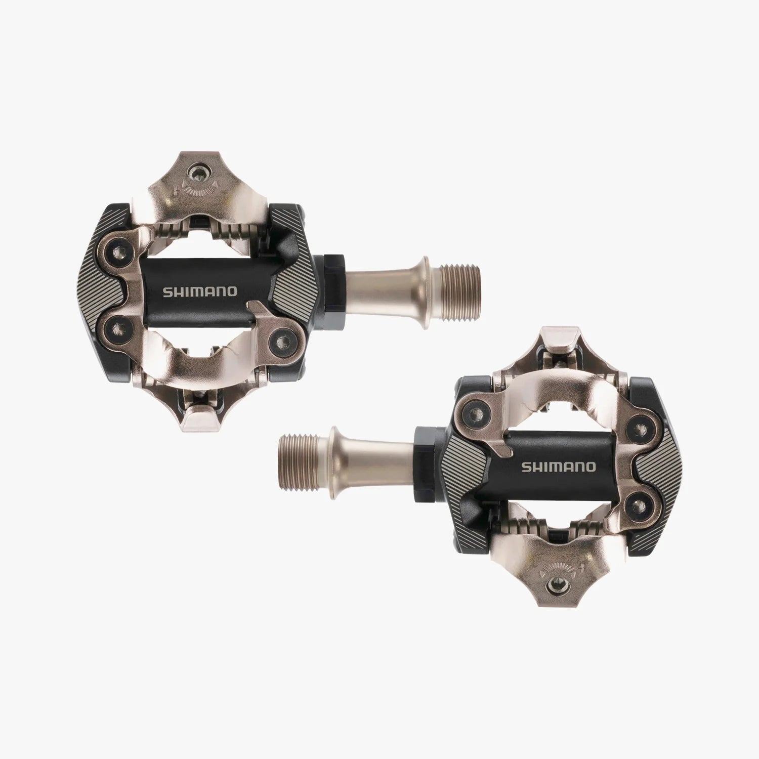 Two Shimano bicycle pedals on a white background