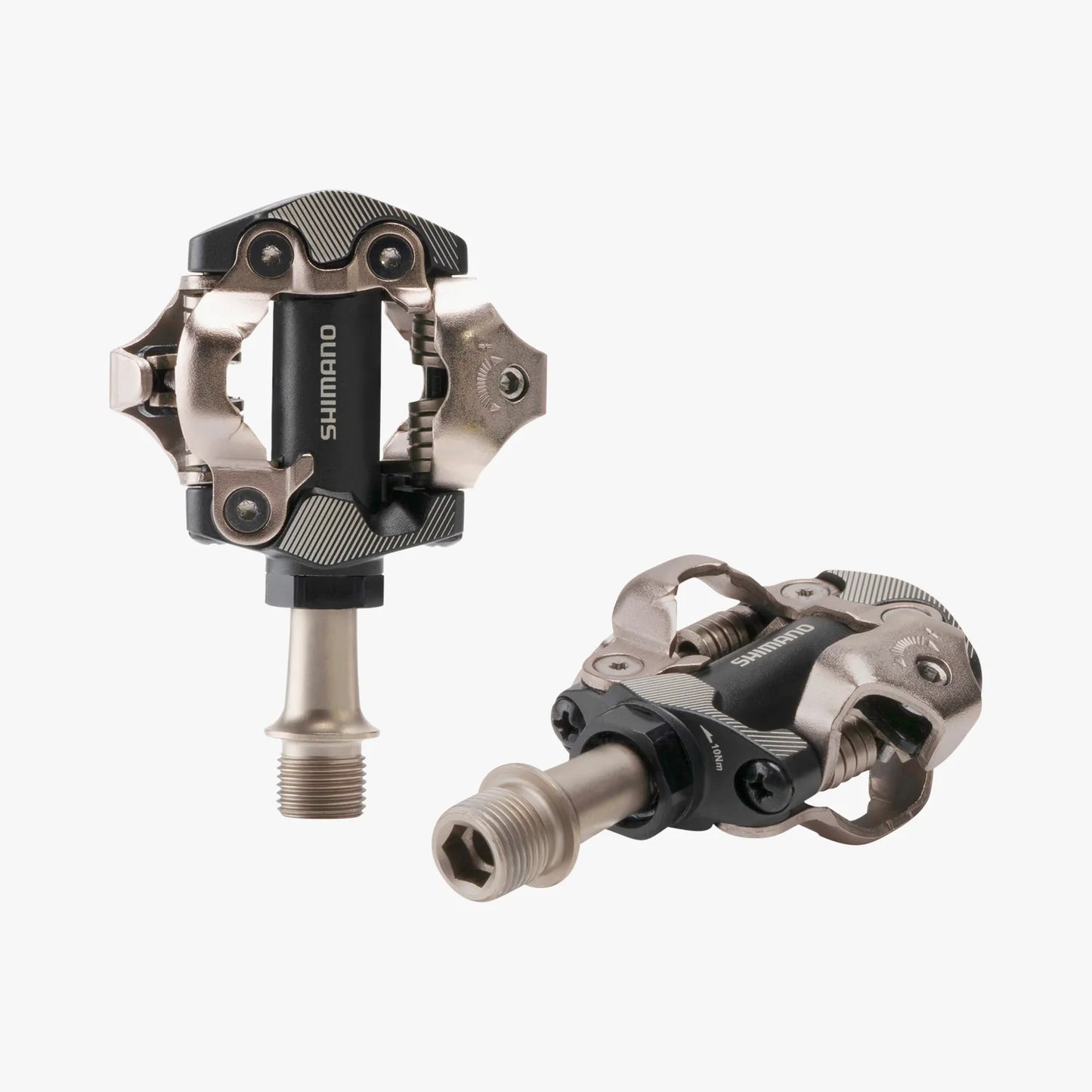 Two Shimano bicycle pedals on a white background