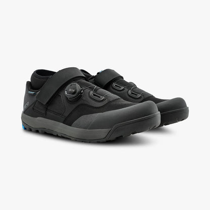 Pair of black shoes with velcro straps on a white background