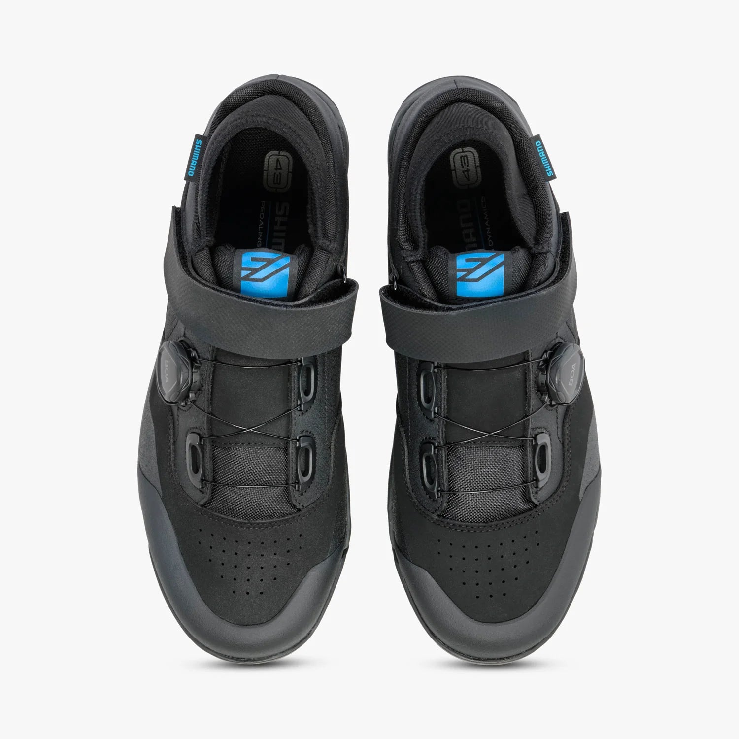 Black athletic shoes with blue accents on a white background