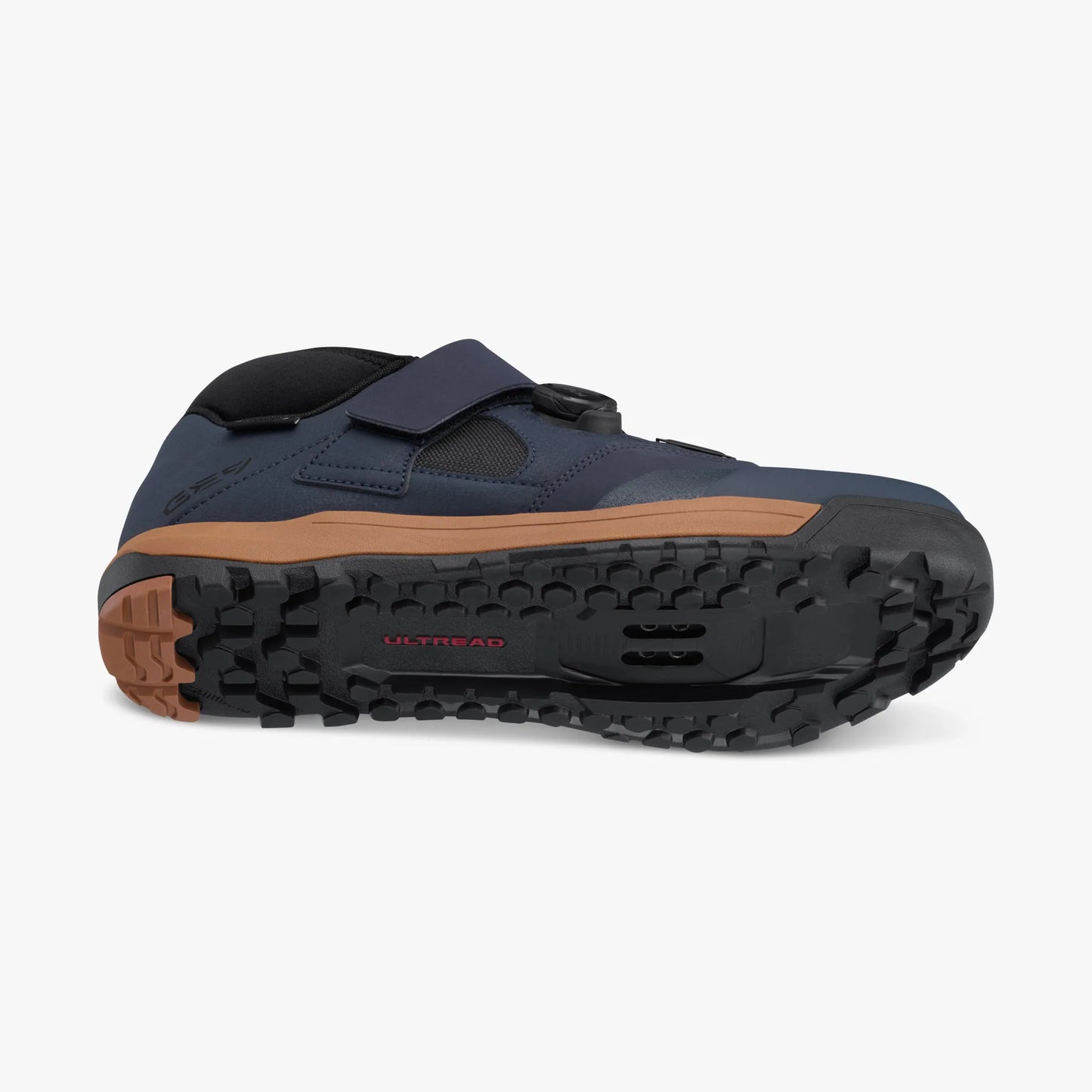 Navy cycling shoe with brown sole on a white background