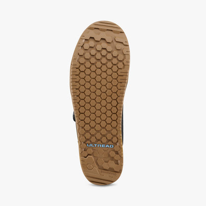 Close-up of a shoe sole with 'Ultread' branding on a white background