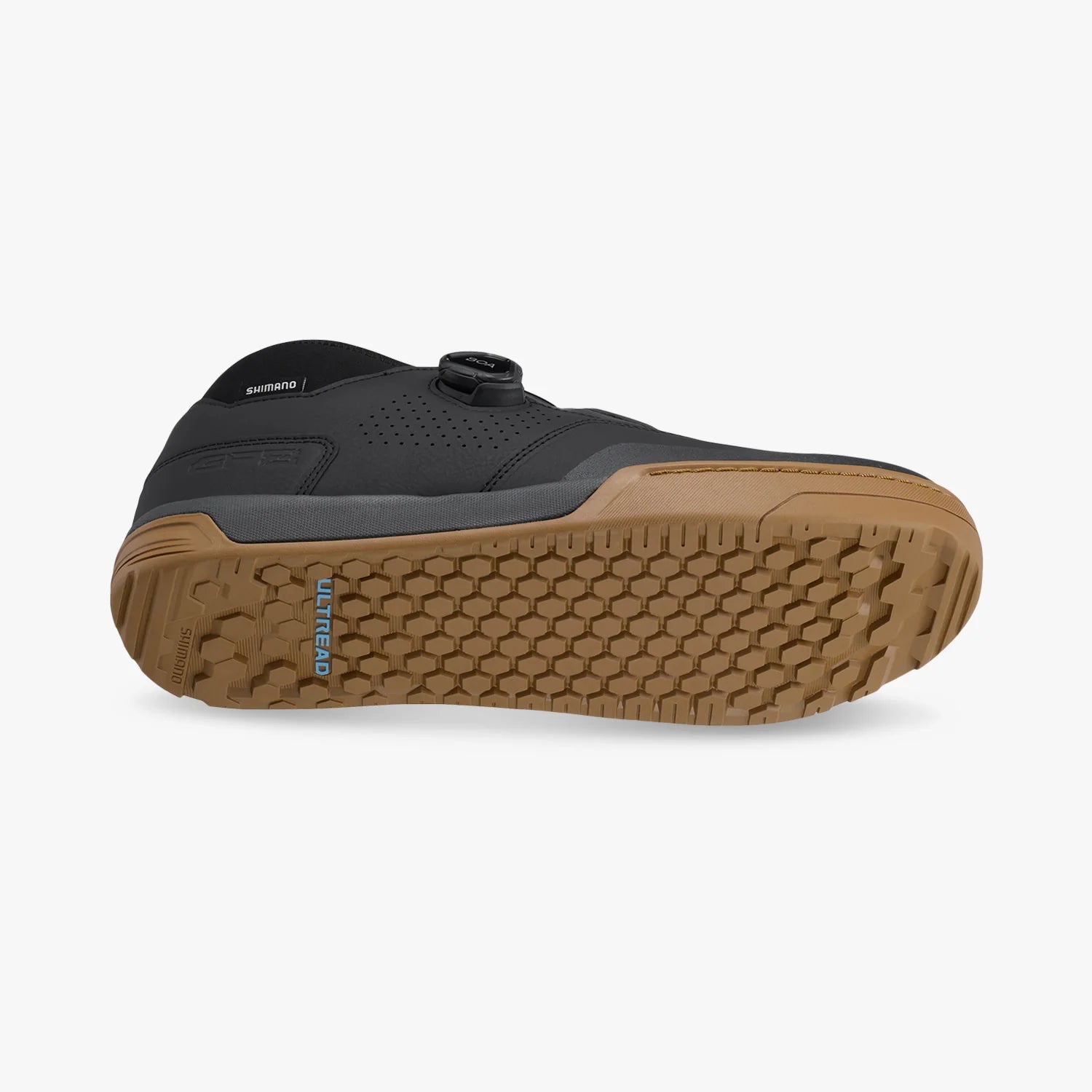 Black and brown shoe with a textured sole on a white background