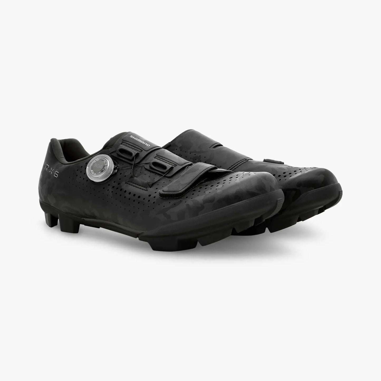 Pair of black cycling shoes on a white background