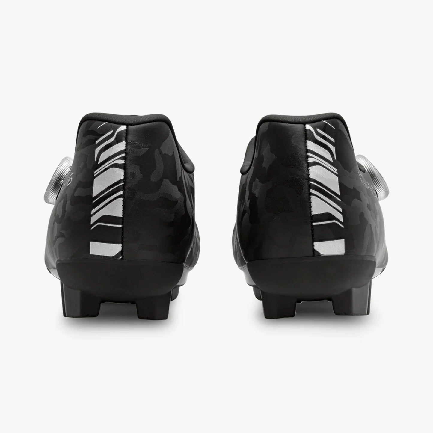 Black soccer cleats with white sole on a white background