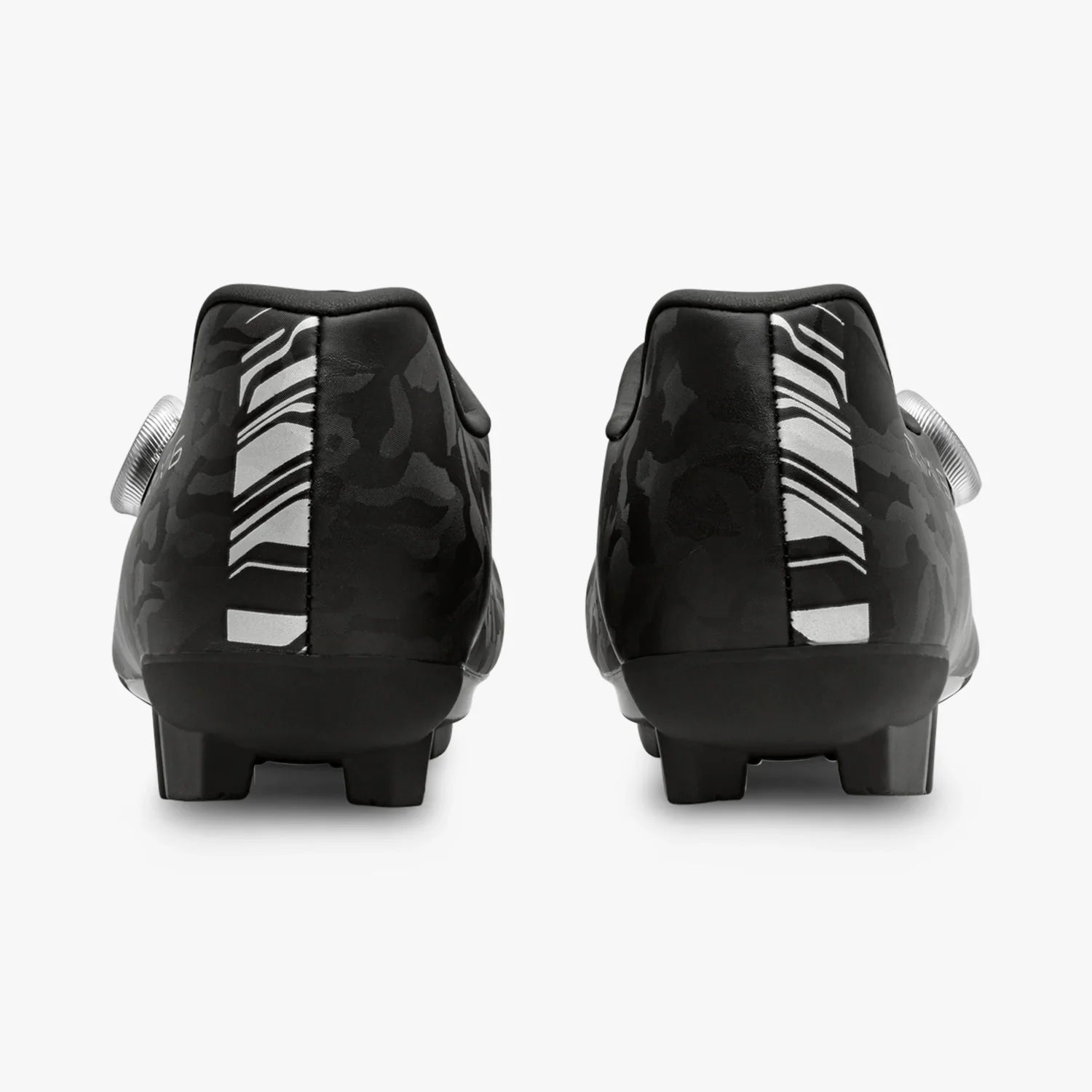 Black soccer cleats with white sole on a white background
