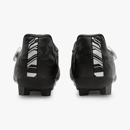 Black soccer cleats with white sole on a white background