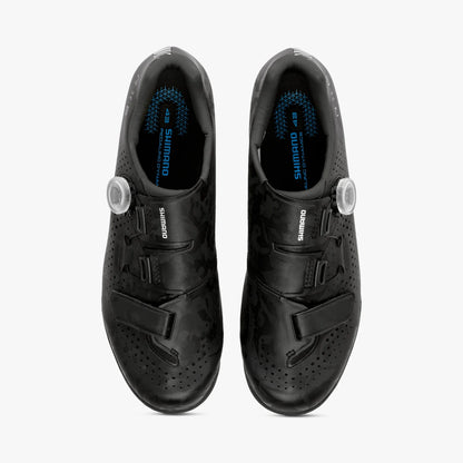 Pair of black Shimano cycling shoes on a white background