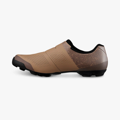 Brown cycling shoe with black sole on a white background