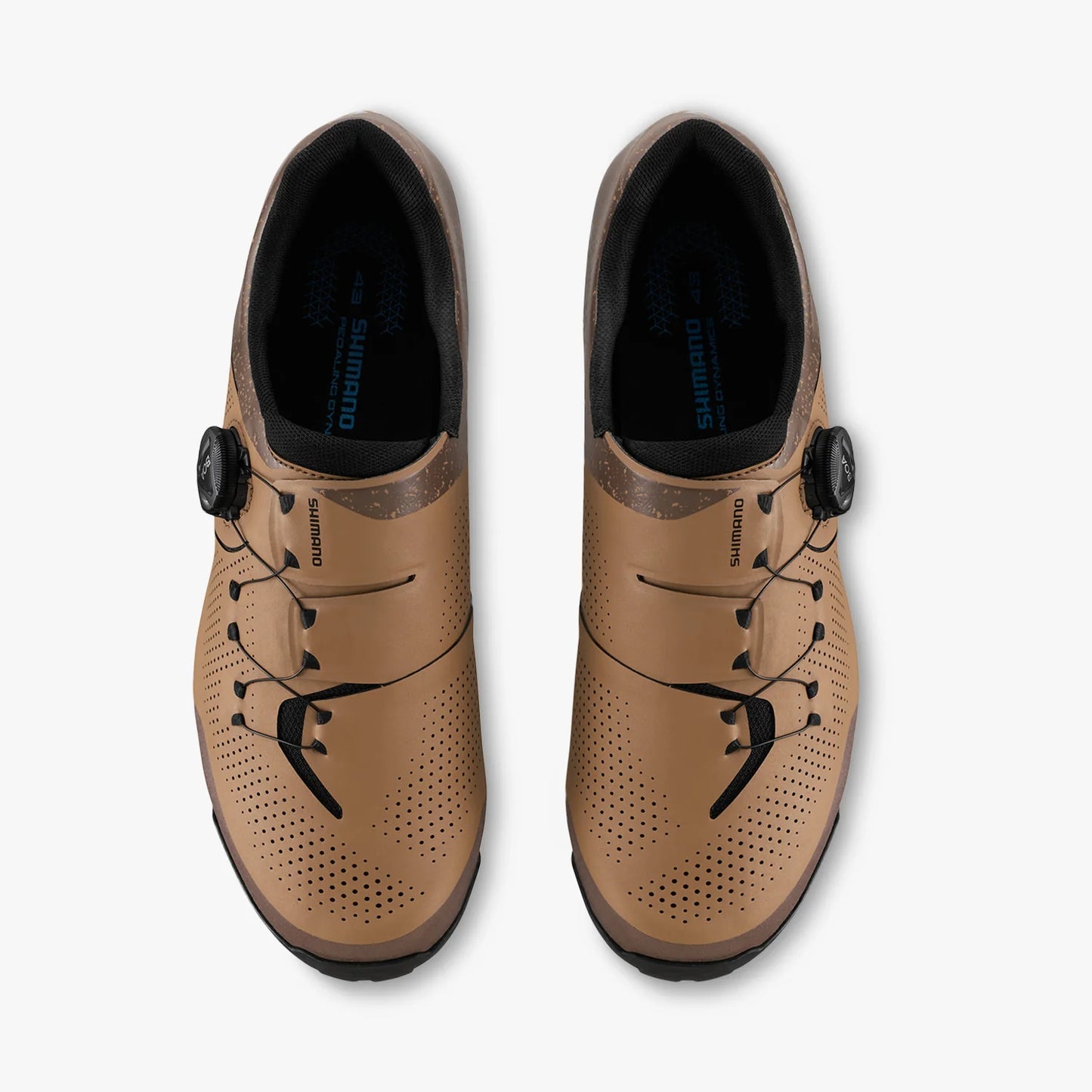 Pair of tan cycling shoes with black laces on a white background