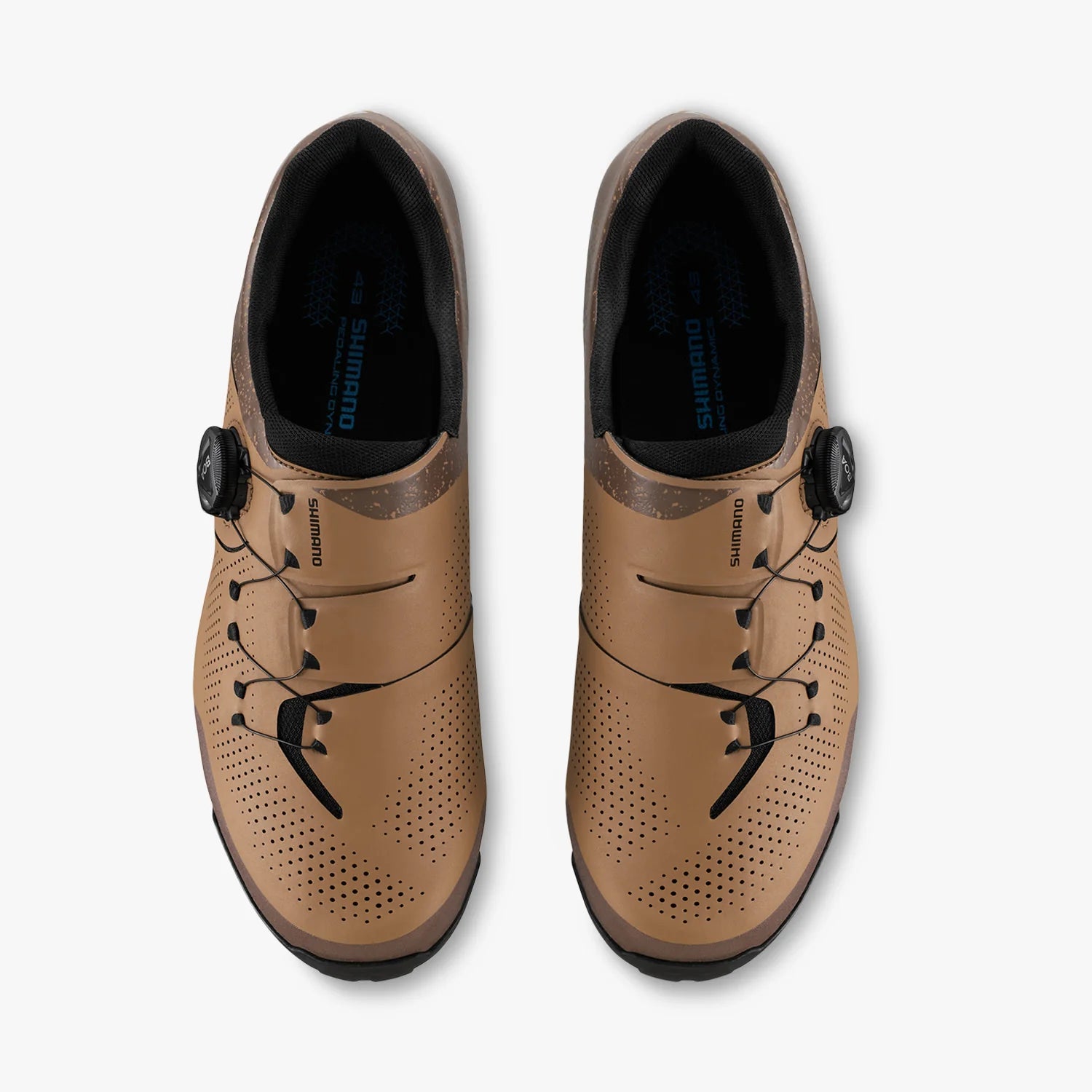 Pair of tan cycling shoes with black laces on a white background