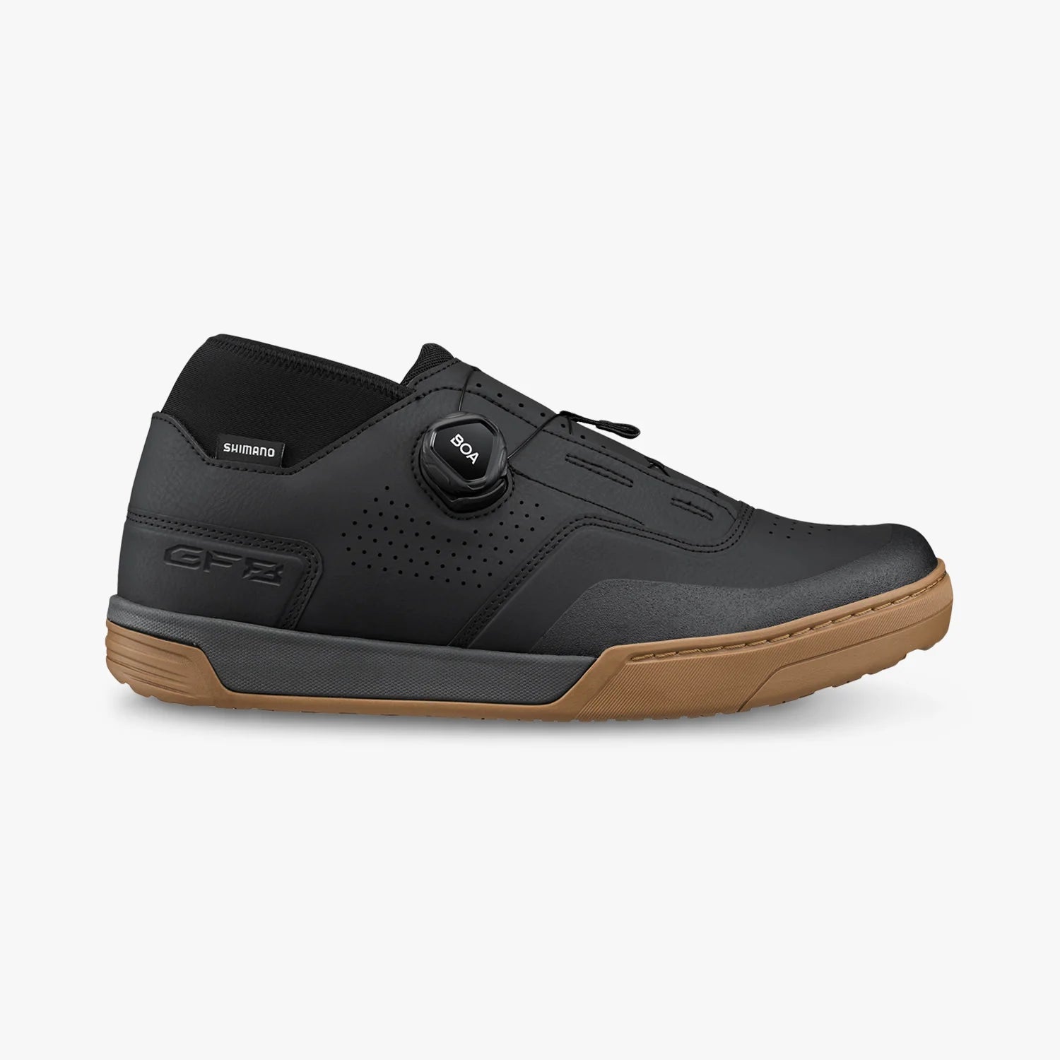 Black cycling shoe with brown sole on a white background
