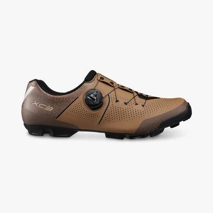 Brown cycling shoe with black accents on a white background