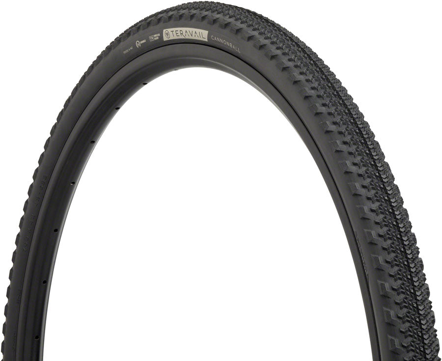 Close-up of a bicycle tire with tread pattern on a white background