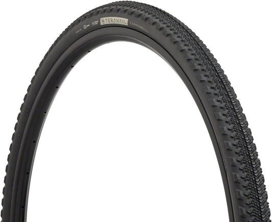 Close-up of a bicycle tire with tread pattern on a white background