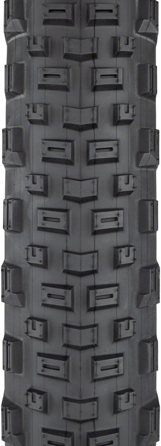 Close-up of a tire tread pattern with geometric design