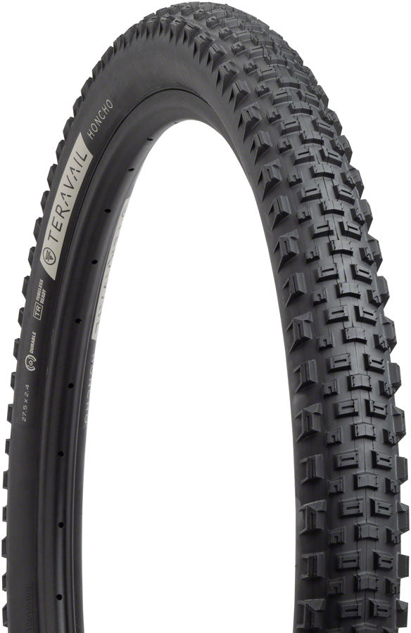 Tire with tread pattern and branding on a white background