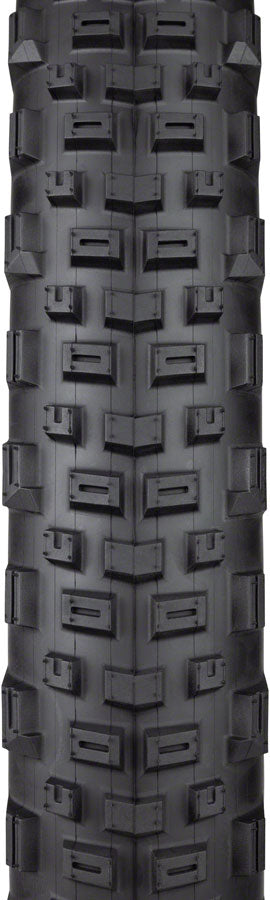 Close-up of a black off-road tire with tread pattern