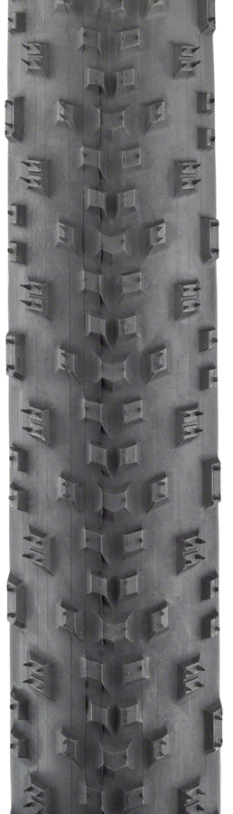 Close-up of a tire tread pattern with geometric design