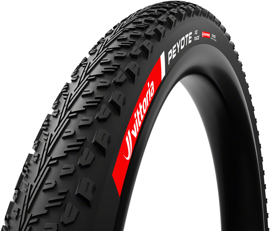 Close-up of a bicycle tire with Vittoria branding on a white background