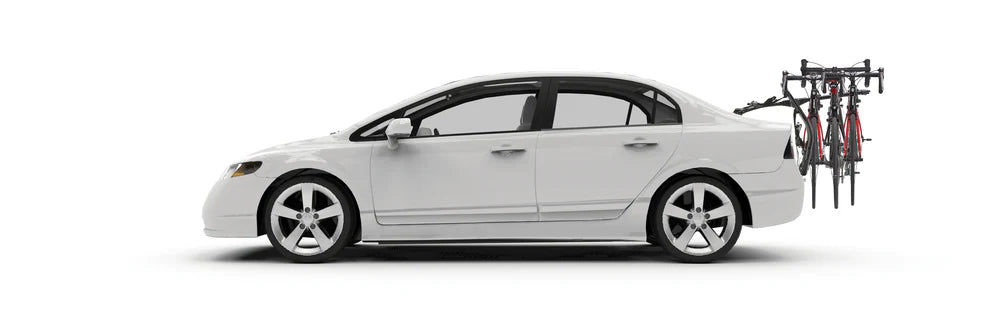 White car with a bike rack attached on a white background