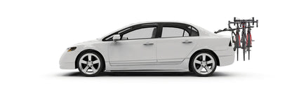 White car with a bike rack attached on a white background