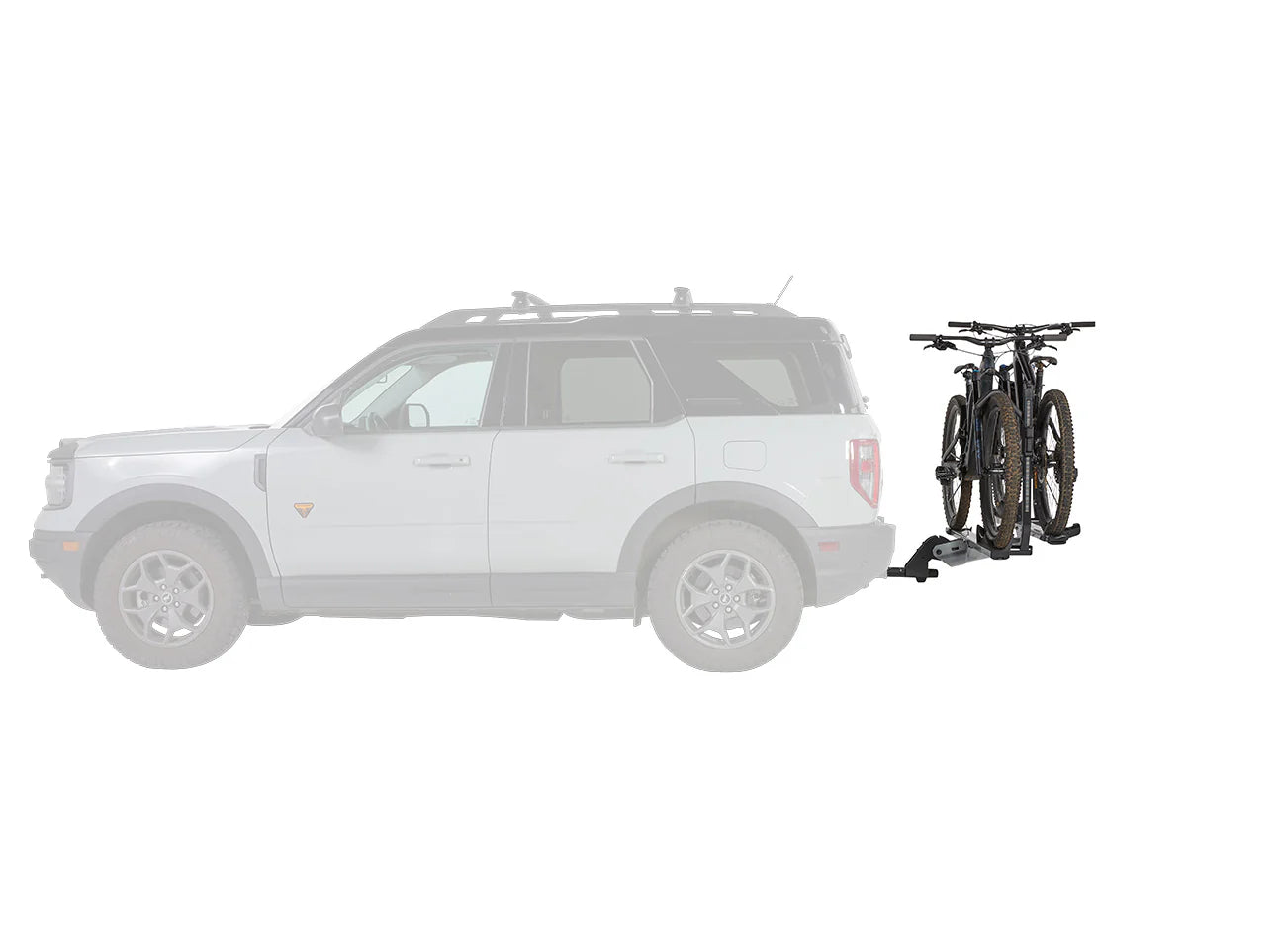 White SUV with a bike rack attached, carrying a bicycle on a white background