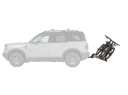 White SUV with a bike rack attached on a white background
