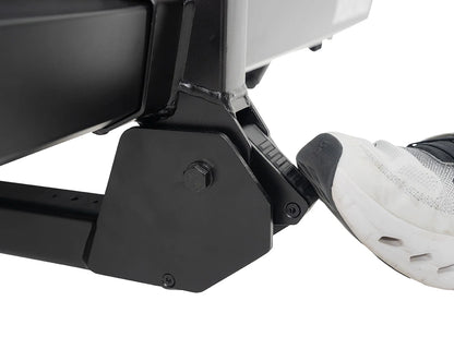 Close-up of a black metal footrest on a white background