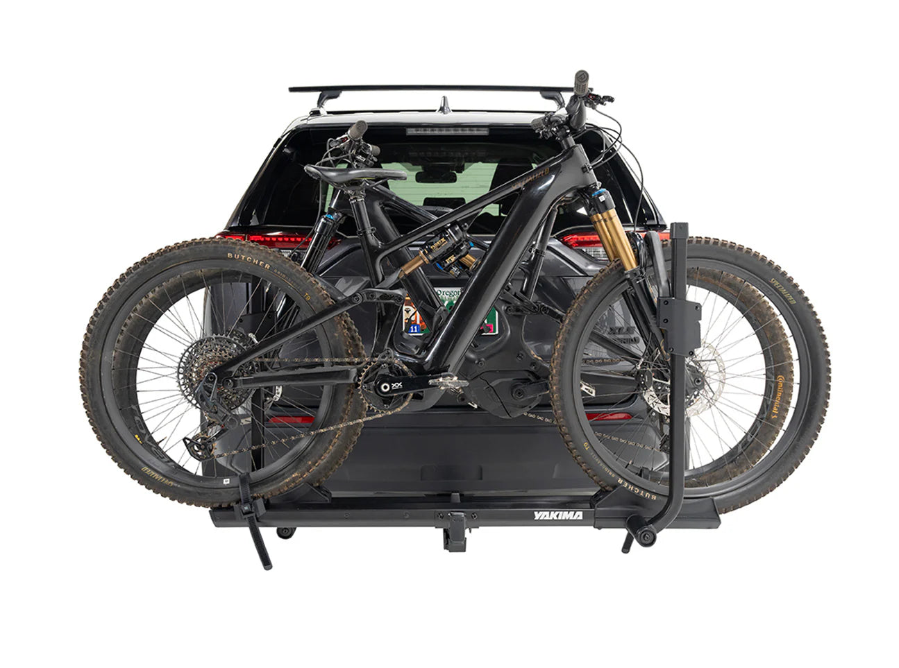 Bicycle rack on a car trunk with two bicycles attached, on a white background
