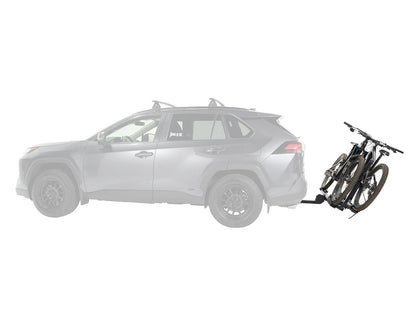 Car with a bike attached to a hitch on a white background