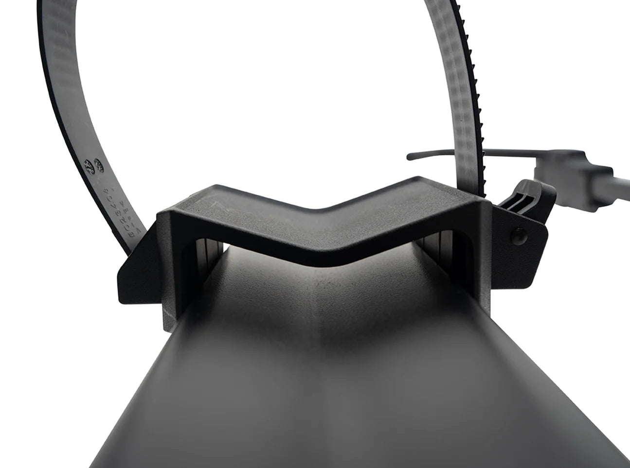 Close-up of a black bike trainer with a white background