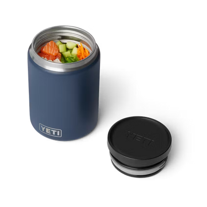 Blue YETI food container with black lid on a white background